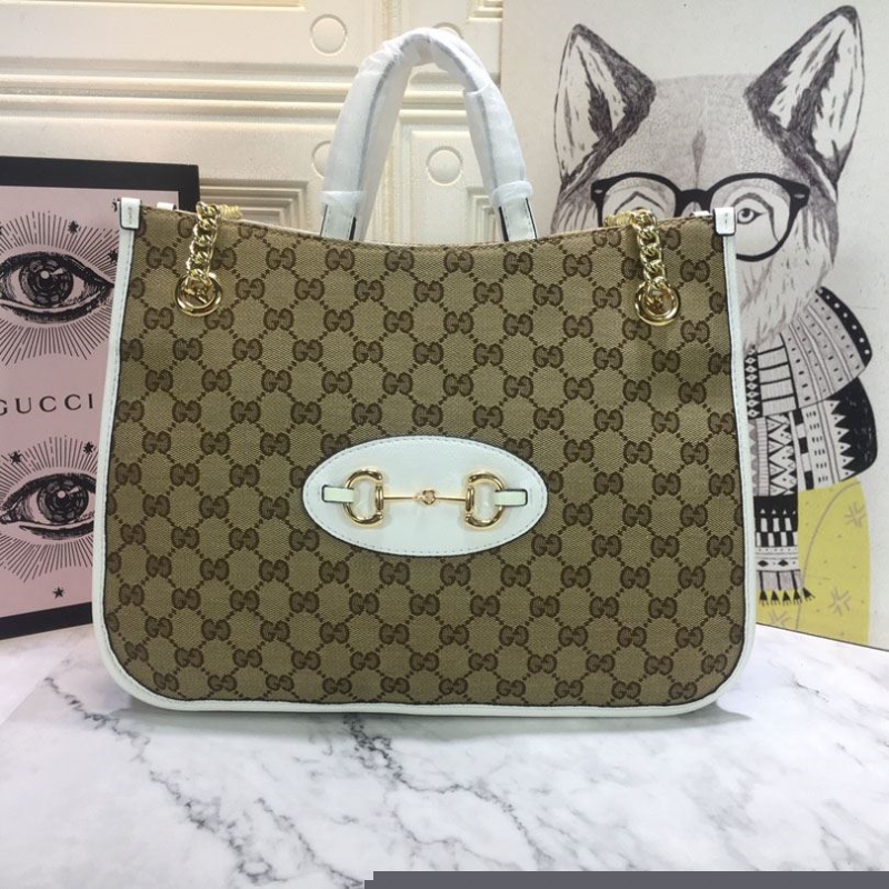 G*u*i shopping bags